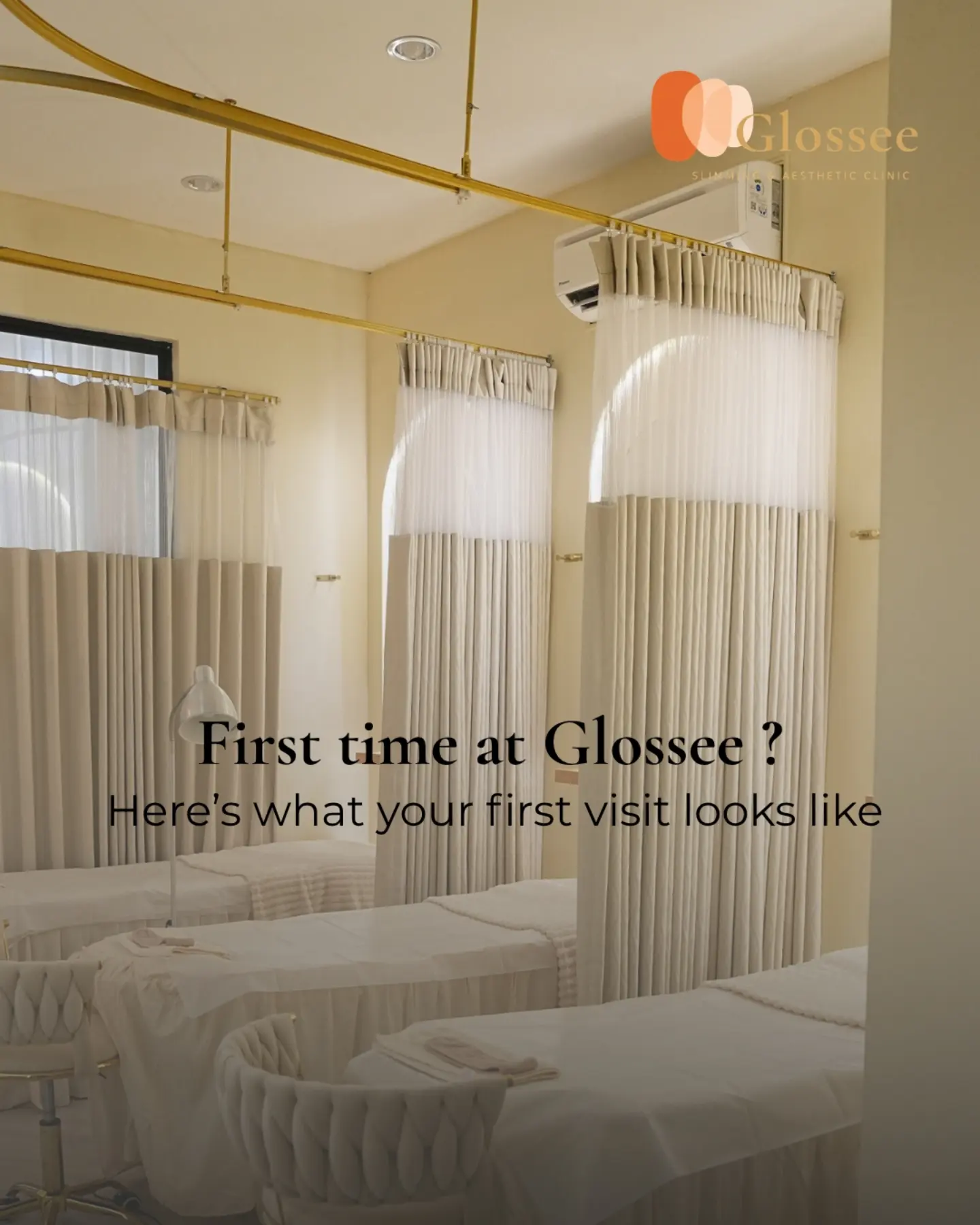 GLOSSEE treatment room with cream curtains and treatment beds